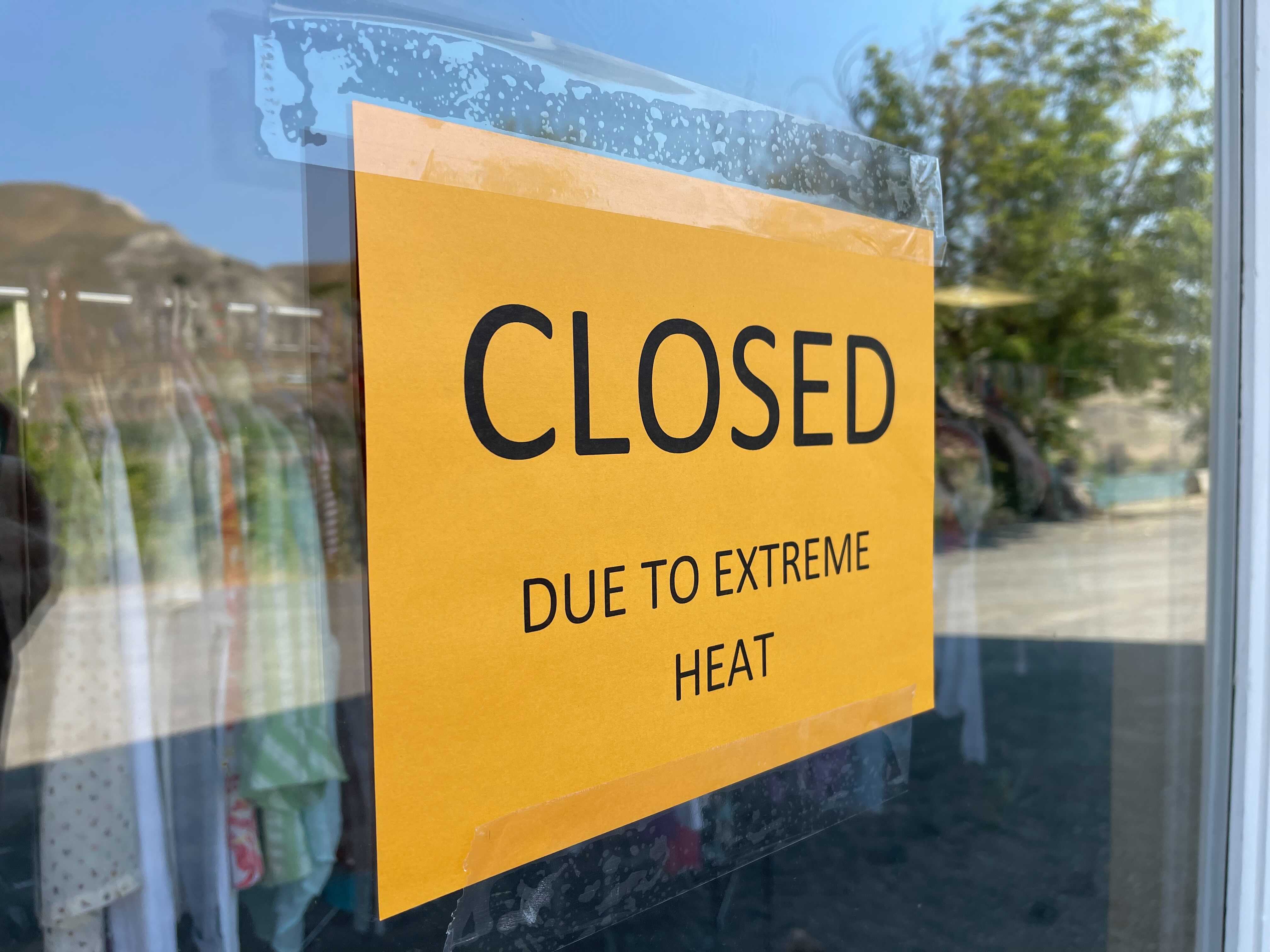 Sign on storefront in Ashcroft BC with text "Closed due to extreme heat"