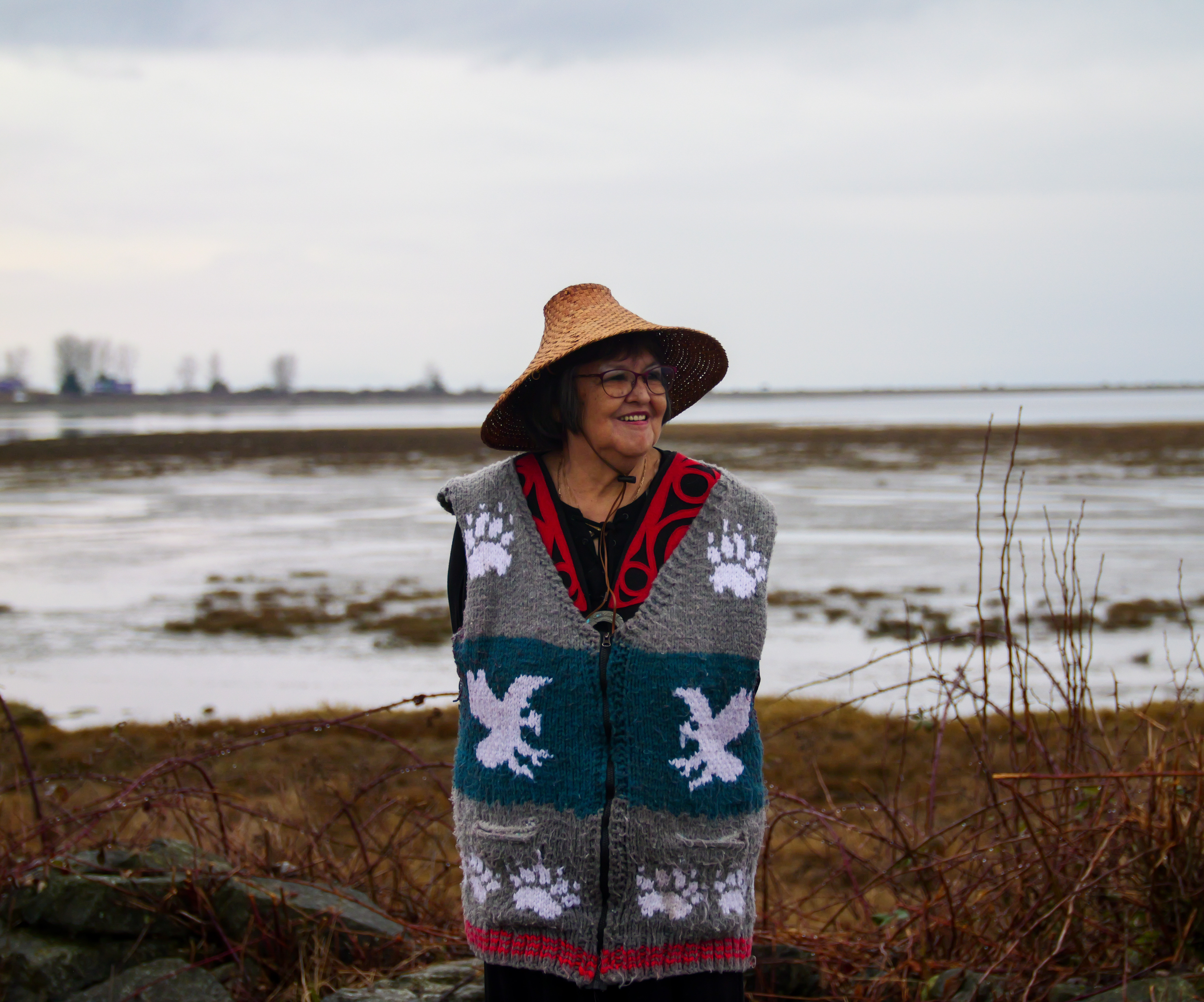 Matriarch Ruth Adams standing in front of the estuary