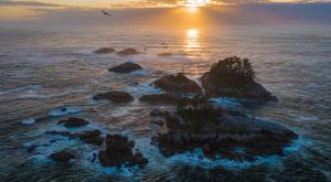 Rocky islands in the sea with sunset